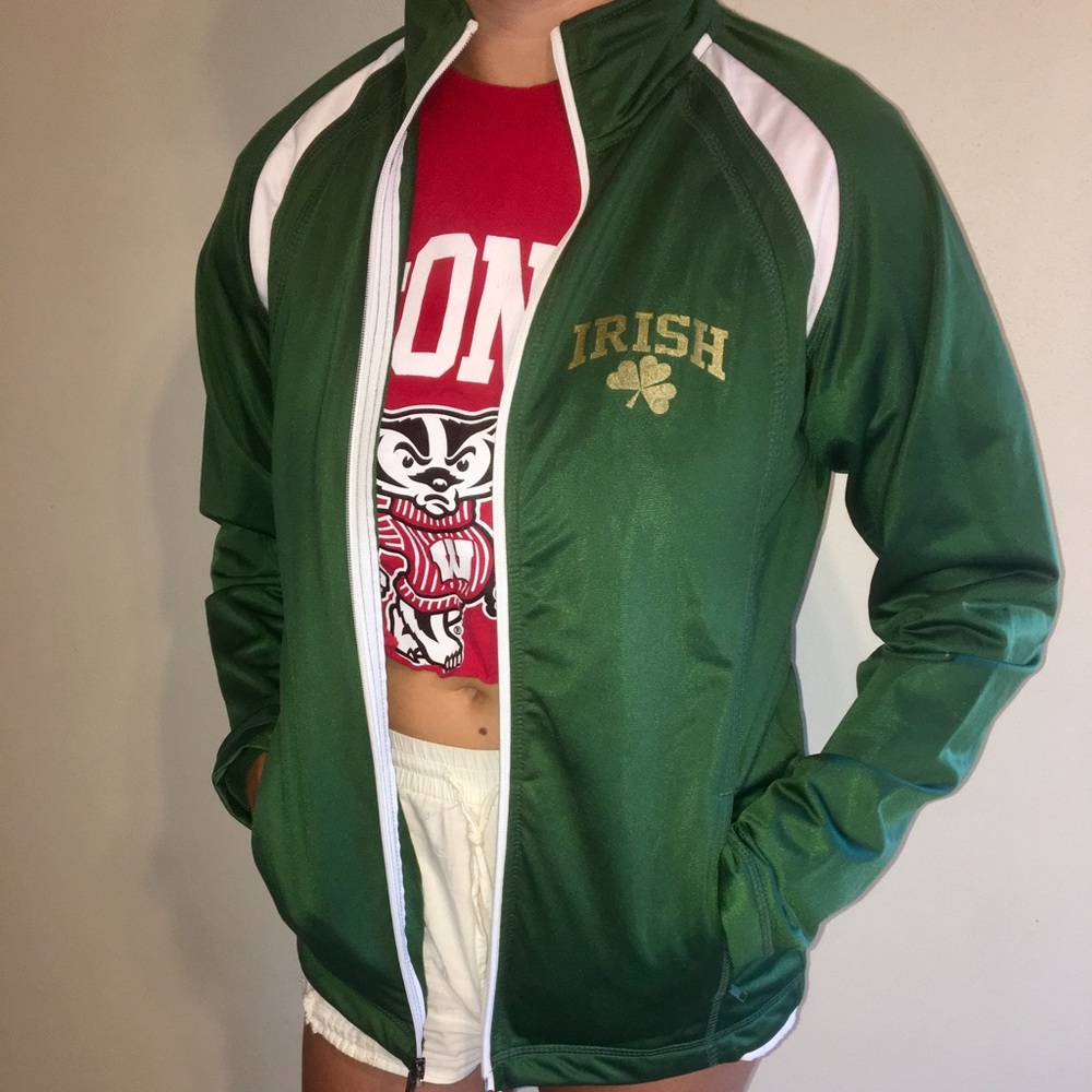 green and white zip-up with gold “IRISH” letters